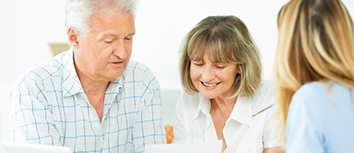 Elderly couple with insurance agent